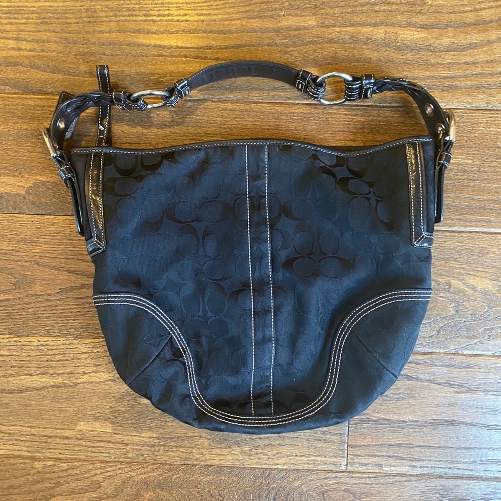 Black signature canvas print Coach shoulder bag.